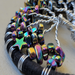 details of dark rainbow hematite star and chips